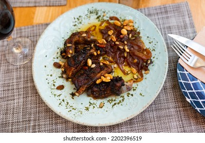 Juicy Fried Pork Chop With Golden Crust Served With Sesame And Walnut