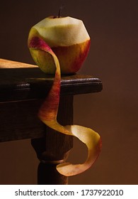 Juicy Green Red Apple, On A Wooden Table, With A Dark Background, Soft Light. Imitation Of A Dutch Kitchen Still Life. Mono Food.