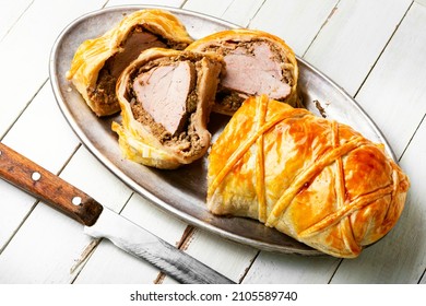 Juicy meat in a dough with spices, mushroom or vegetable pate. Wellington meat.