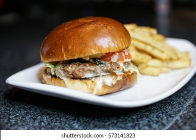 Juicy And Messy Cheeseburger With Home Fries