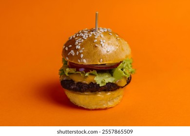 The juicy mini cheeseburger with lettuce, onion, tomato, and melted cheese on sesame seed buns, placed against a vibrant orange background. Perfect for fast food, snack, or gourmet concepts. - Powered by Shutterstock