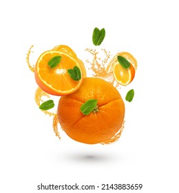 Juicy orange bursting its juice and flying pieces of fruit and mint leaves. Concept design for healthy diet, vitamins, healthy breakfast, fitness and more. Isolated on a white background 