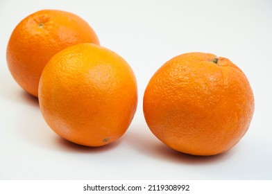 juicy oranges on a white background. sweet big tangerines on the table.orange citrus fruits on a light texture