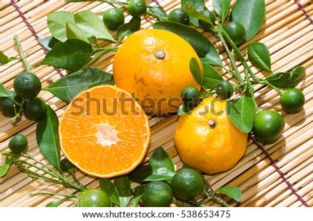 juicy oranges in studio lighting on hay background