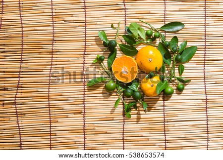 juicy oranges in studio lighting on hay background