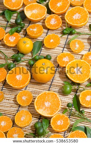 juicy oranges in studio lighting on hay background