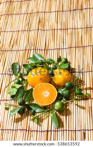 juicy oranges in studio lighting on hay background