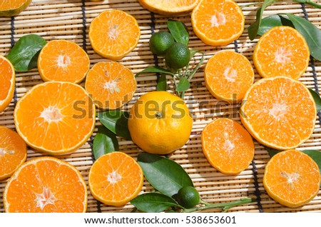 juicy oranges in studio lighting on hay background