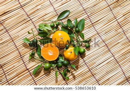 juicy oranges in studio lighting on hay background