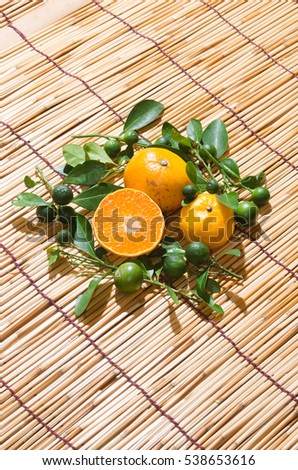 juicy oranges in studio lighting on hay background