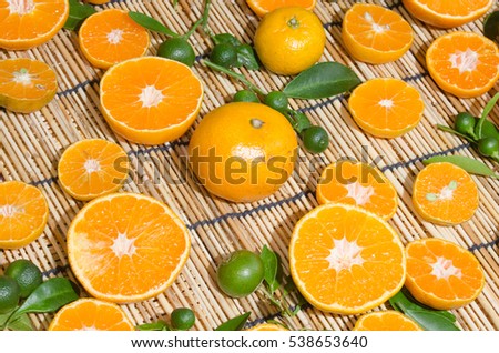 juicy oranges in studio lighting on hay background