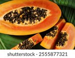 Juicy papaya fruit slices top view. Tropical papaya fruit background. Papaya fruit closeup.