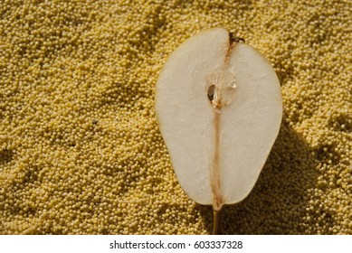 A Juicy Pear On Millet Background