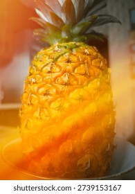 Juicy pineapple on the kitchen table background