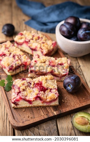 Similar – square pieces of cake crumble with cherry