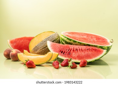 Juicy Ripe Fresh Piece Of Watermelon And Melon Cantaloupe, Peaches And Strawberries. Summer Pastel Green Background, Side View. Seasonal Berries And Fruits