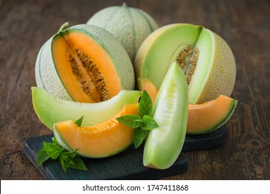 Juicy ripe melons on the wooden table