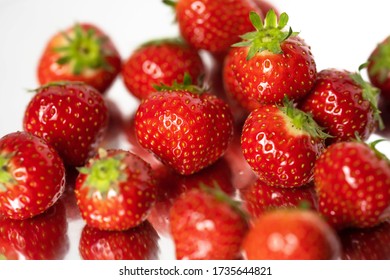 juicy ripe strawberries with green leaves - Shutterstock ID 1735644821