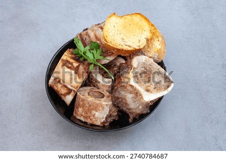 juicy roasted marrow bones with crispy bread, South African delicasy