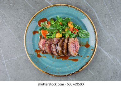 Juicy Skirt Steak In Addition With A Vegetable Garnish. Dish From The Chef