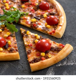 Juicy slice of meat pizza with corn and tomato on black background. Close up shot. Delicious Pizza. Traditional italian food, top view. Nutrition dinner or lunch. 1x1 format.