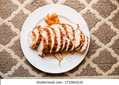 Juicy Sliced Turkey Breast On A White Plate For Serving Top Down