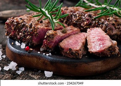 Juicy steak medium rare beef with spices - Shutterstock ID 234267049