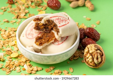 Jujube paste walnut cake with solid color background,枣泥核桃It means jujube paste and walnut