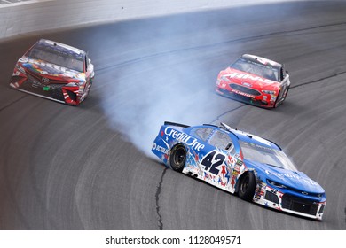 July 01, 2018 - Joliet, Illinois , USA: Kyle Larson (42) goes for a spin after connect with Kyle Busch (18) while coming to the checkered flag to win the Overton's 400 at Chicagoland Speedway