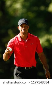 July 1, 2012; Bethesda, MD, USA; Tiger Woods waves to the crowd after the 13th green during the final round of the AT&T National at Congressional Country Club. 