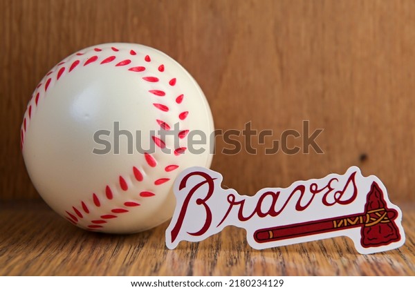 July 19, 2022, Cooperstown,\
New York. The emblem of the Atlanta Braves baseball club and a\
baseball.