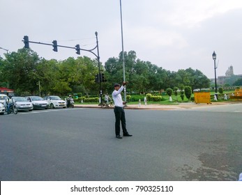 July 2017, Delhi, India - Traffic Police Controlling The Traffic By Standing In The Middle Of The Road In Delhi