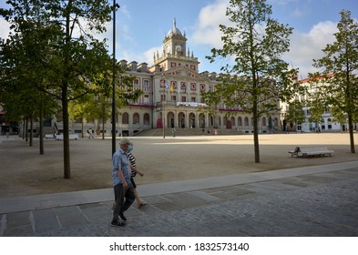 July 2020, Ferrol. View Of A Couple Taking A Walk By The 