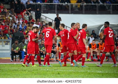 July 24, 2015- Shah Alam, Malaysia: Liverpool's players (red) celebrate a goal scored in a friendly match against the Malaysian Team. Liverpool Football Club from England is on an Asia tour.