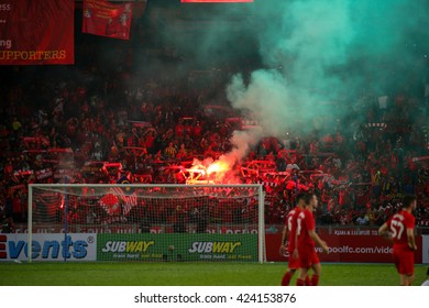 July 24, 2015- Shah Alam, Malaysia: Liverpool's fans let off red flares in the spectators gallery after the match between Liverpool FC and Malaysia. Liverpool FC from England is on an Asia tour.