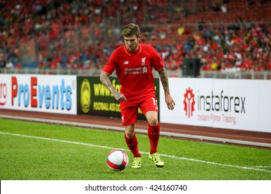 July 24, 2015- Shah Alam, Malaysia: Liverpool's Alberto Moreno dribbles the ball in a friendly match against the Malaysian Team. Liverpool Football Club from England is on an Asia tour.