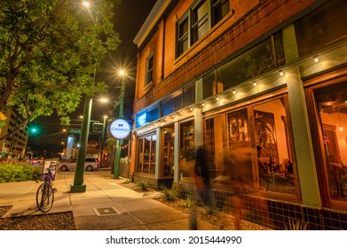 July 24, 2021- Tucson, Arizona, United States - Charro Steak Restaurant In Tucson At Night, With People Sitting Inside 