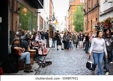 July 26, 2011, Dublin, Ireland - the famous Temple Bar district area with tourists and artists performing on the streets.