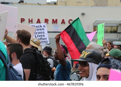 July 26th, 2016 Philadelphia, PA: Democratic National Convention - A Man walks with the Black Lives Matter movement carrying a Pan-African Flag