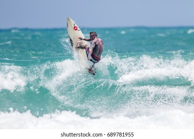 JULY 29: unidentified surfer in Kata beach surfing contest in rainy season at Kata beach Phuket on July 29-30, 2017 in Kata beach, Phuket, Thailand.