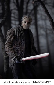JULY 30 2019: Friday the 13th slasher Jason Voorhees with machete lurking in the woods - NECA Ultimate Jason action figure