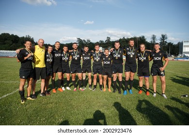 JULY 4, 2021 - KHARKIV, UKRAINE . Powerful Skillful Athletes Posing For Team Photo After Rugby Sevens Match. Rugby-7 Ukrainian Championship Final Tour.