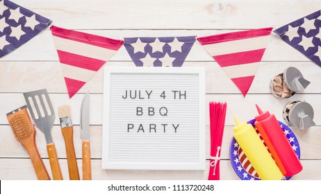 July 4th BBQ Party Sign On Memo Board With July 4th Decorations.