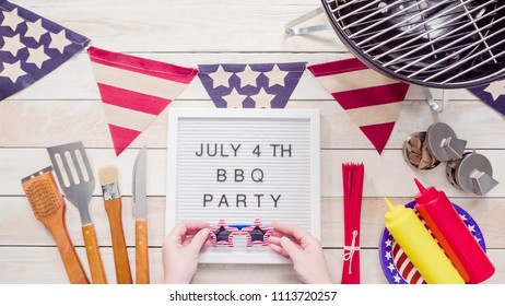 July 4th BBQ Party Sign On Memo Board With July 4th Decorations.