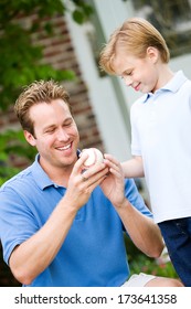 July 4th: Dad And Boy Playing Baseball Outside