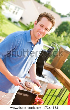 July 4th: Father Cooking Dinner By Grill