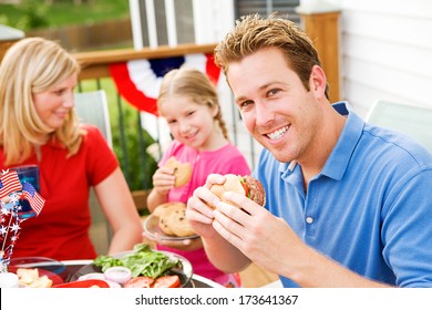 July 4th: Smiling Dad At Outdoors Cookout Dinner