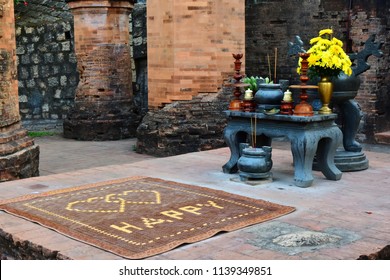 July 5, 2018. Nha Trang.Vietnam. Prayer mat with a HAPPY nardis writing for the newlyweds in the medieval Ponagar temple complex. Place for the prayer of betrothed and married couples. Valentine's Day