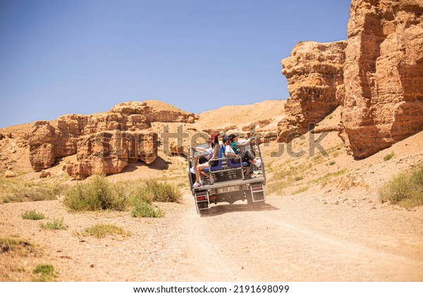 July 6, 2022,\
kazakhstan, charyn canyon. off-road taxi 4x4 bringing people from\
the river valley to the\
plateau
