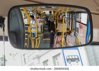 July 7, 2021, Khabarovsk, Russia. Reflection Of The Interior Of A Modern Bus And Passengers Through The Rear-view Mirror In The Bus. View From The Driver's Seat.